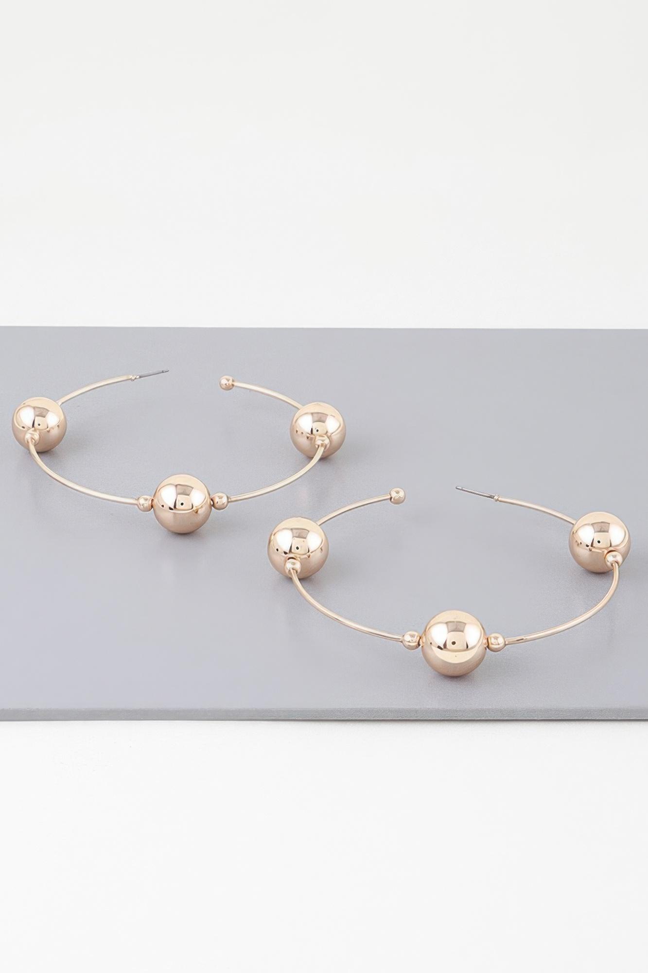 Triple shiny bead hoop earrings image